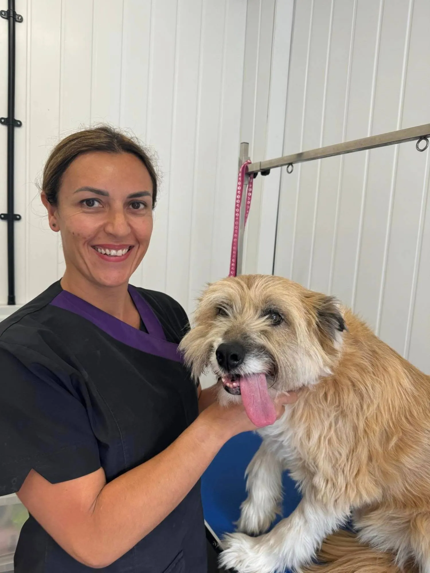 Emma with a freshly groomed dog at Pawfect Pet Services, Wells